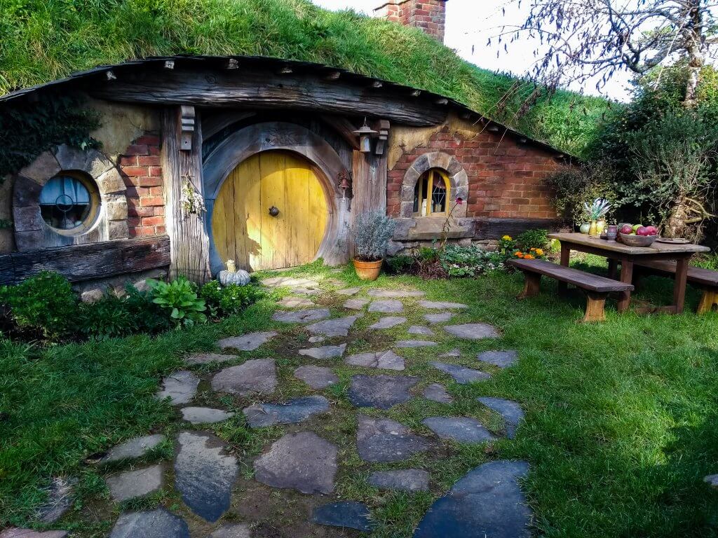 hobbiton hobbit hole with yellow door