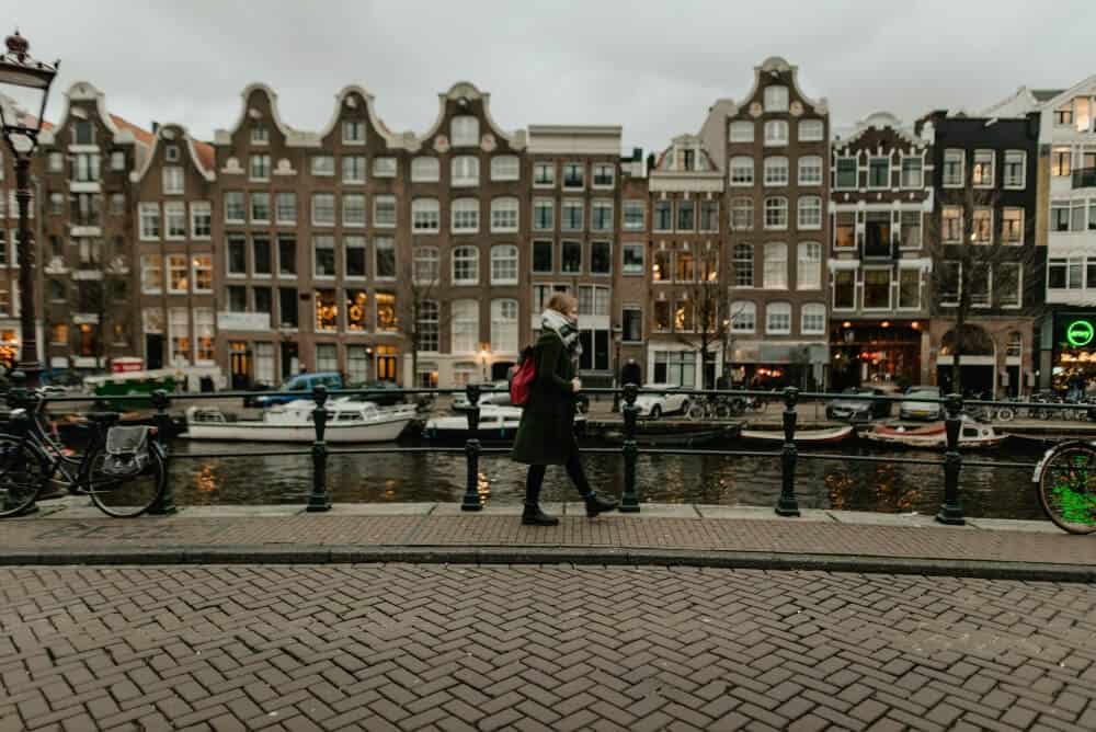 How to Plan the Perfect Festive Winter Mini-Break 8 Person walking through Amsterdam in winter
