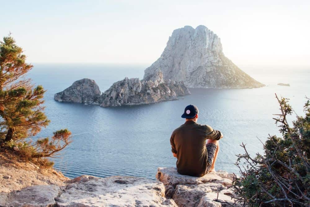 Travelling Alone While in a Relationship: Can You Do It? 4 man looking across the sea for travelling alone while in a relationship