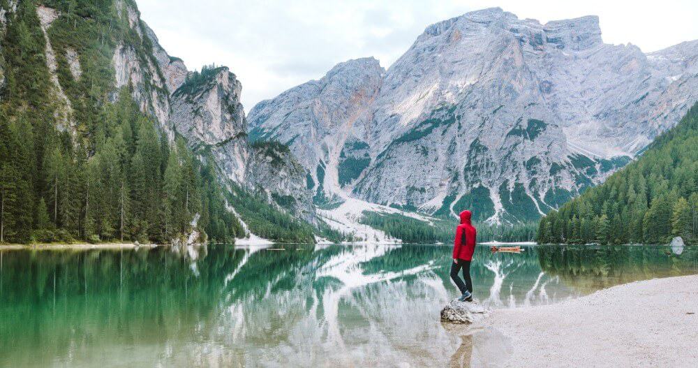 Travelling Alone While in a Relationship: Can You Do It? 5 person wearing a red jacket travelling alone while in a relationship