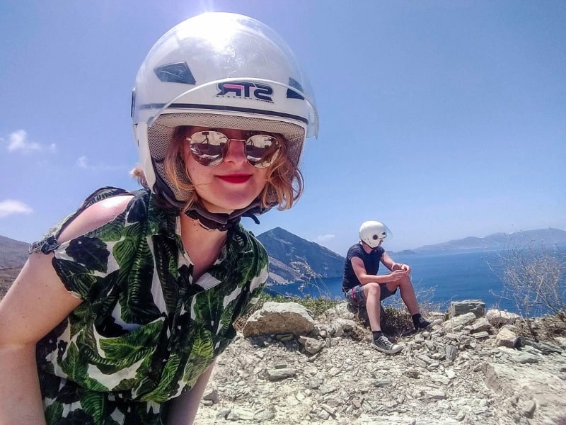 How to Travel with Friends When You're Used to Going Solo 1 My partner and I wearing helmets in when we were travelling together in Greece.
