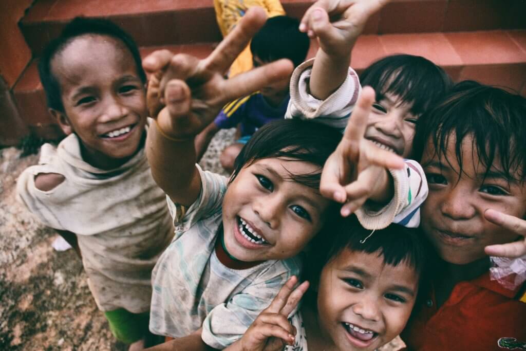 Why Voluntourism Does More Harm Than Good 5 children smiling in vietnam