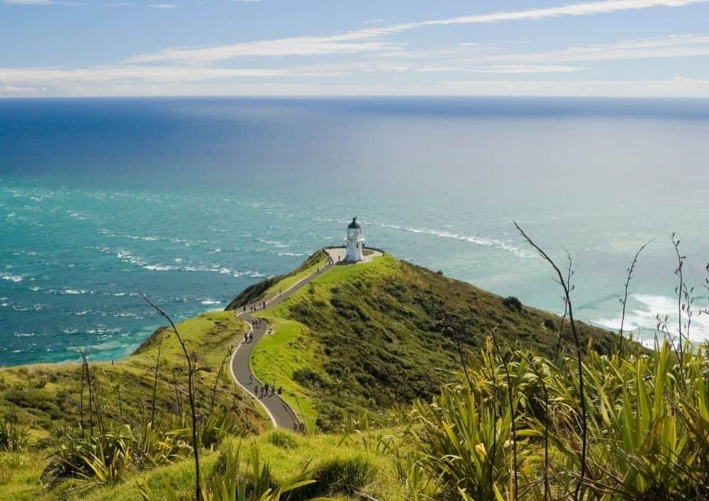 View of Cape Reinga with the lighthouse in the distance. A bonus trip on this 3 day Bay of Islands itinerary. 