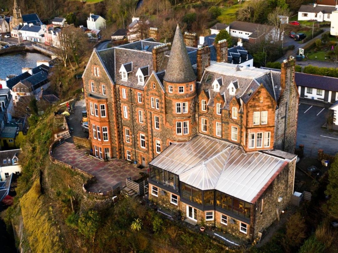 Mull Accommodation: Best Places To Stay on Mull in 2026 7 Image from above of a tall Western Isles Hotel in Tobermory, Mull.