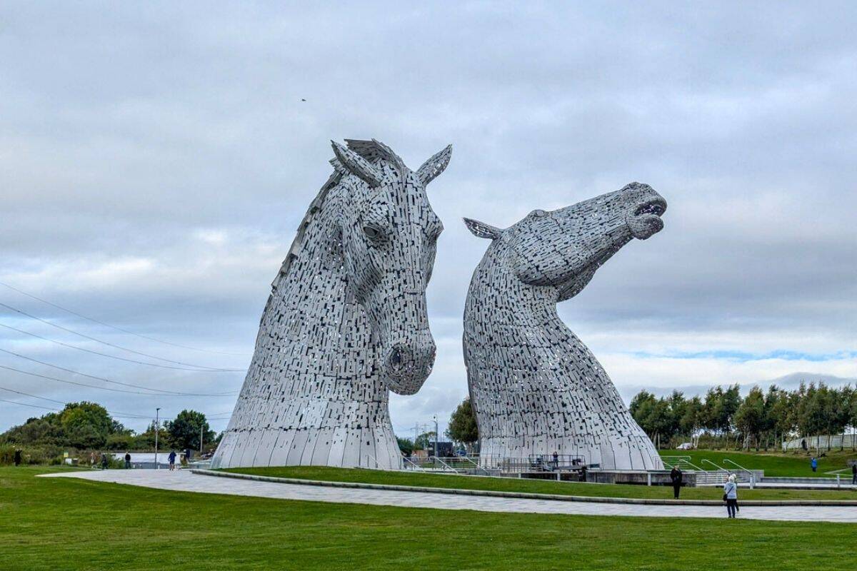 Two silver horses heads - the Kelpies in Scotland's Falkirk, one of the best day trips from Edinburgh by train or bus.