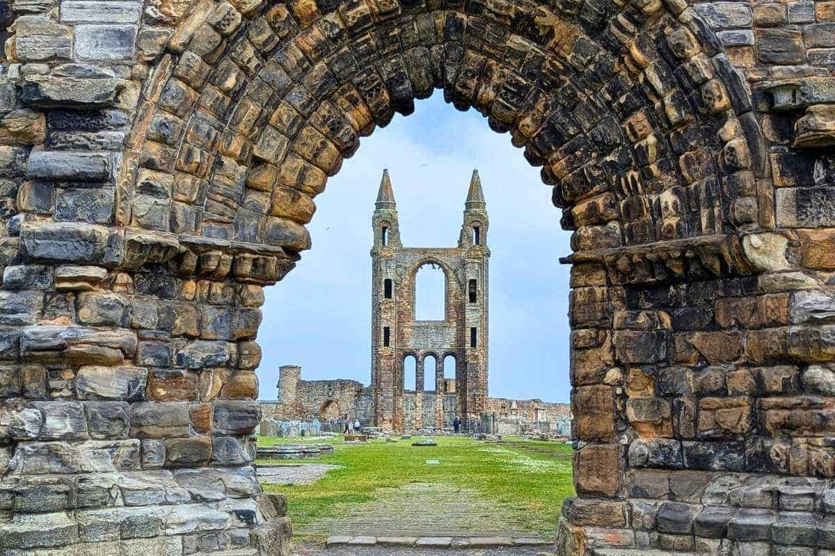 View of a tower in St Andrews Cathedral, framed by a ruined archway. 