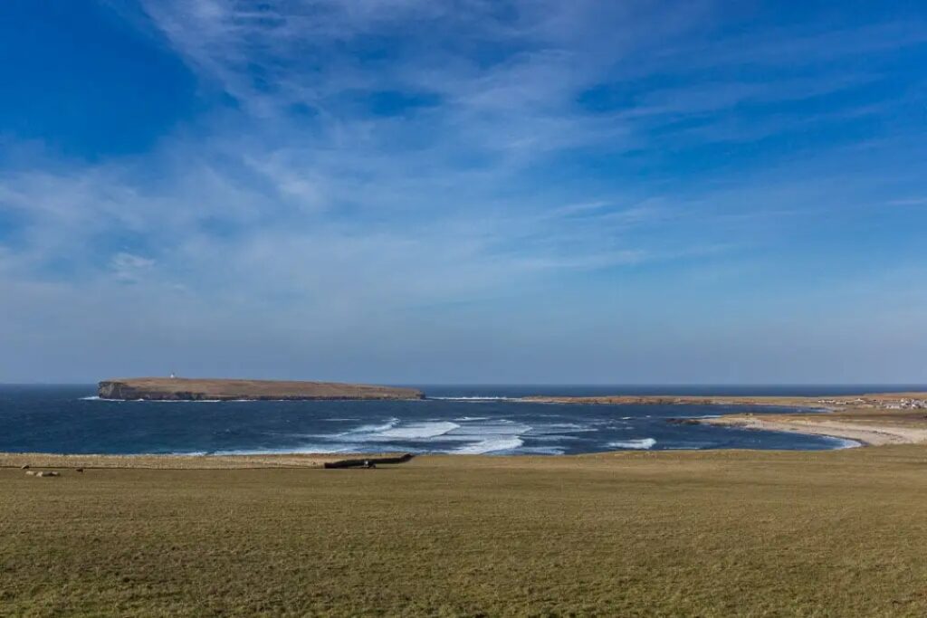 View of beaches and waves breaking in the bay at Birsay in Orkney in Scotland. 