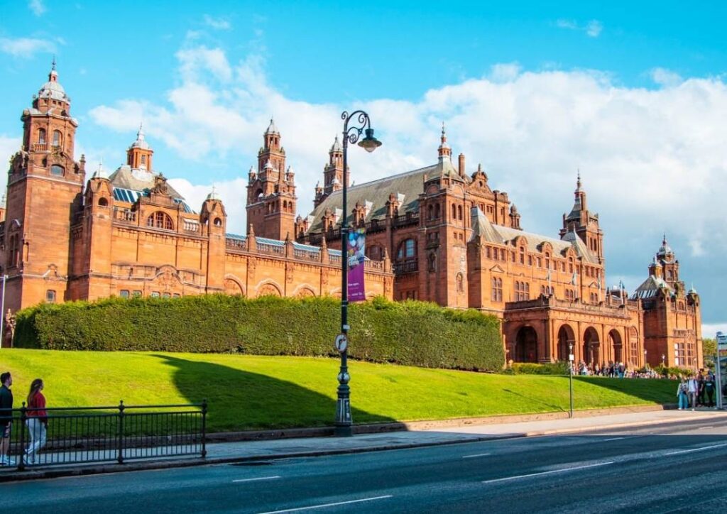 Terracota coloured museum in Glasgow, Scotland on a sunny day. 