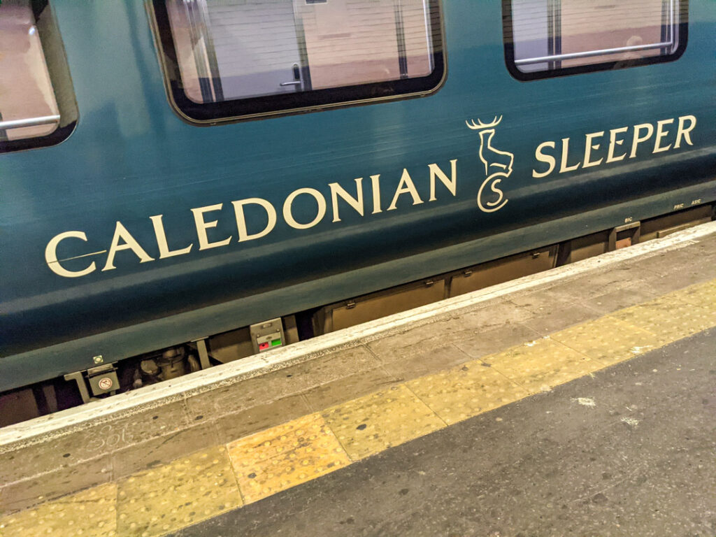 The blue exterior of the Caledonian Sleeper at Euston Station in London. 
