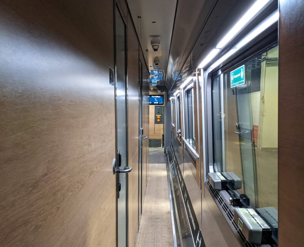 Inside the carriage. The corridor outside the rooms of the sleeper train. 