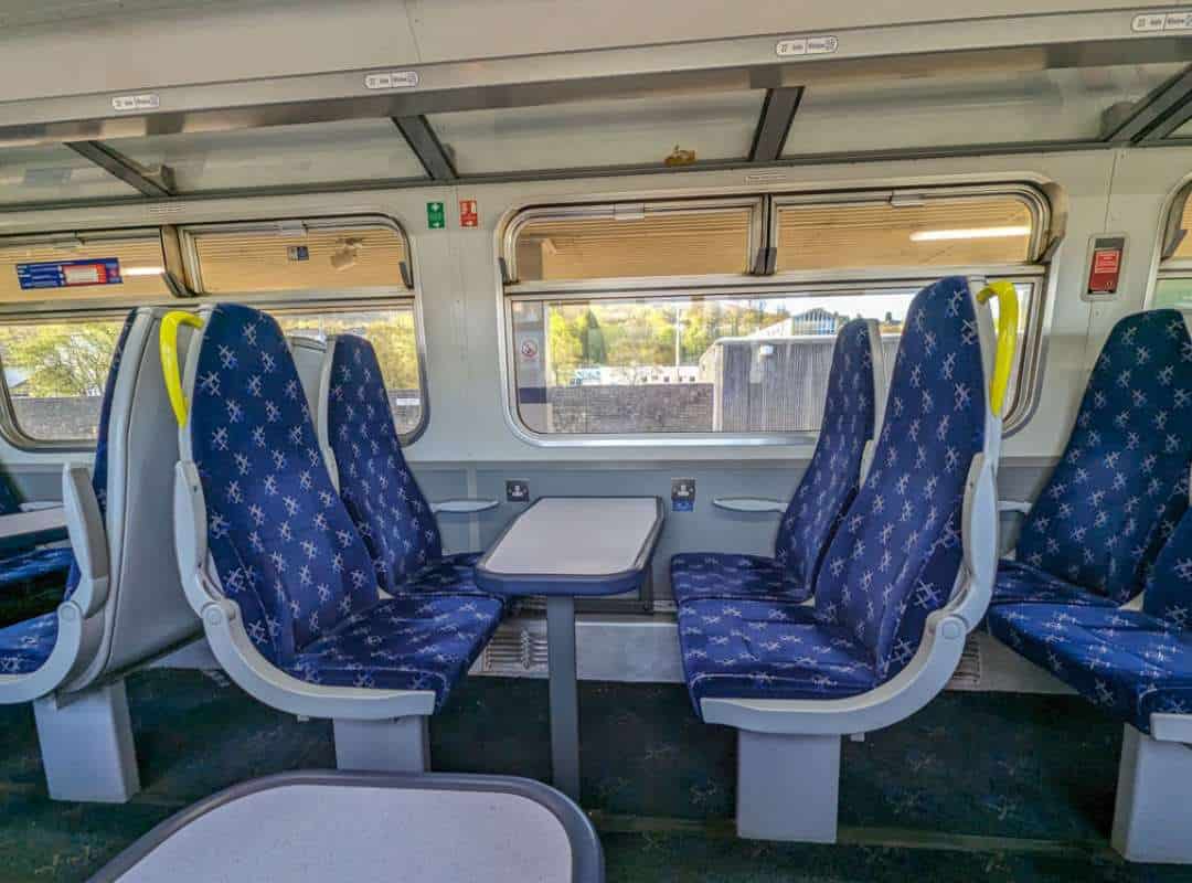 An empty four seater surrounding a table on a ScotRail train. 