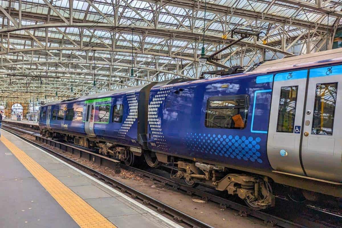 13 Best Places to Visit in Scotland by Train 15 Blue and silver ScotRail train carriage waiting at the platform in Edinbugh.