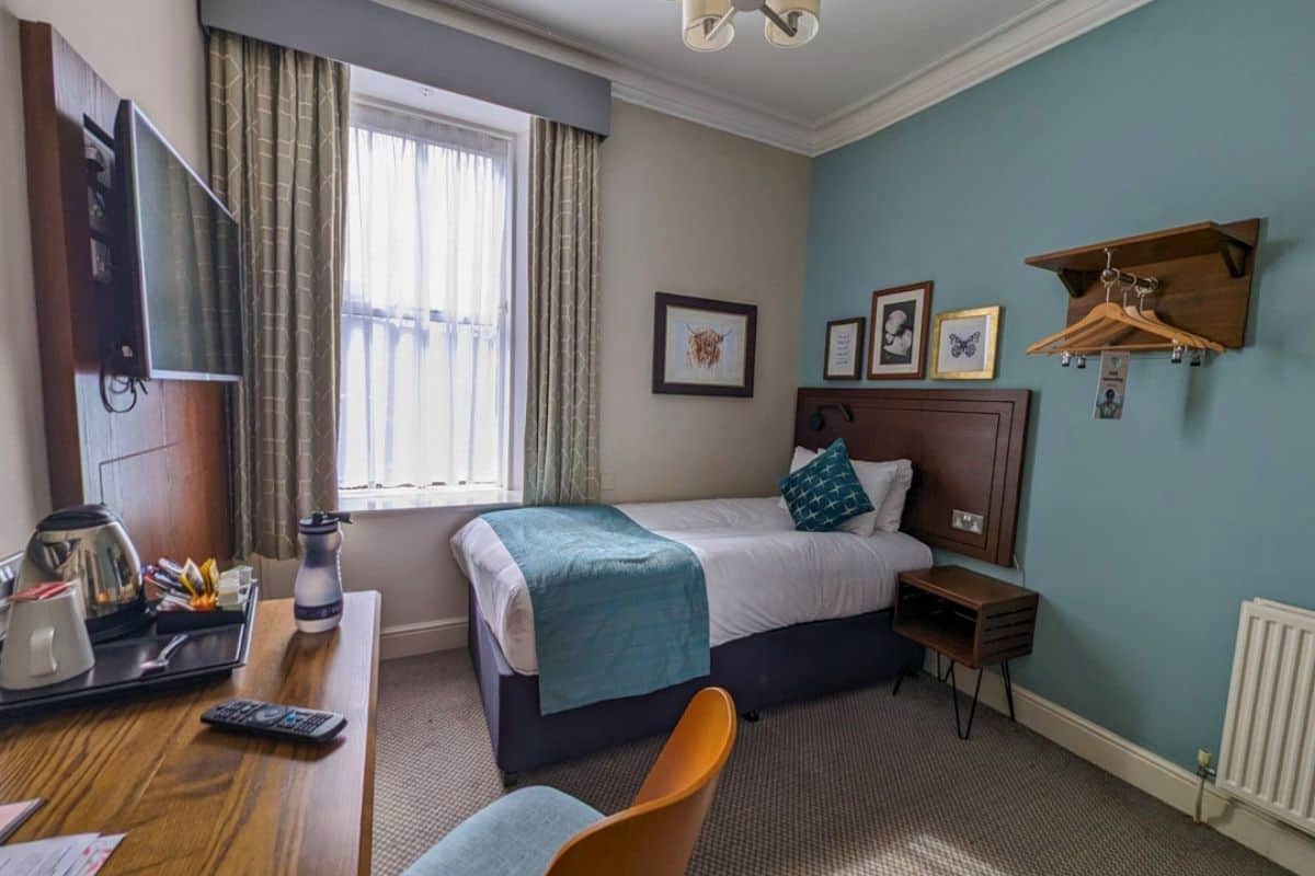 Where to Stay in Scotland Without a Car: Best Areas + Hotels 22 A single bed in a simple but nicely furnished room at Balloch House in Balloch.