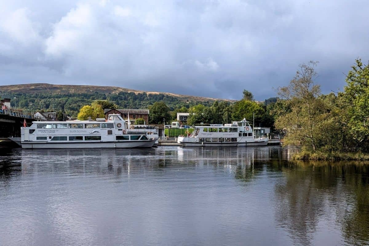 Where to Stay in Scotland Without a Car: Best Areas + Hotels 21 Two white boats on the River Leven in Balloch for where to stay in Scotland without a car.