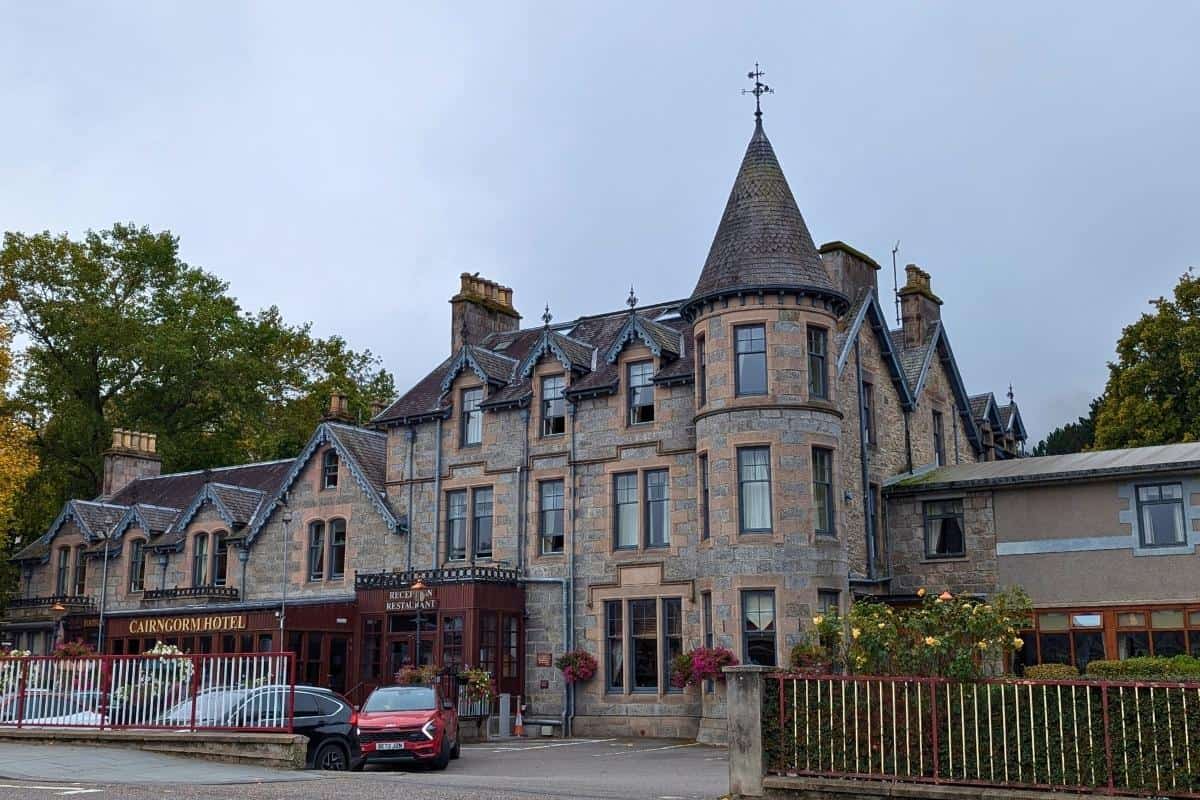 Where to Stay in Scotland Without a Car: Best Areas + Hotels 13 View of a grand Victorian building with a tower. The Cairngorm Hotel in Aviemore.