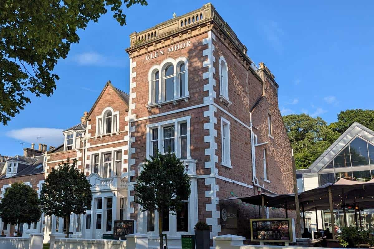 Where to Stay in Scotland Without a Car: Best Areas + Hotels 4 The outside of Glen Mhor Hotel, a grand Victorian building for where to stay in Scotland without a car.