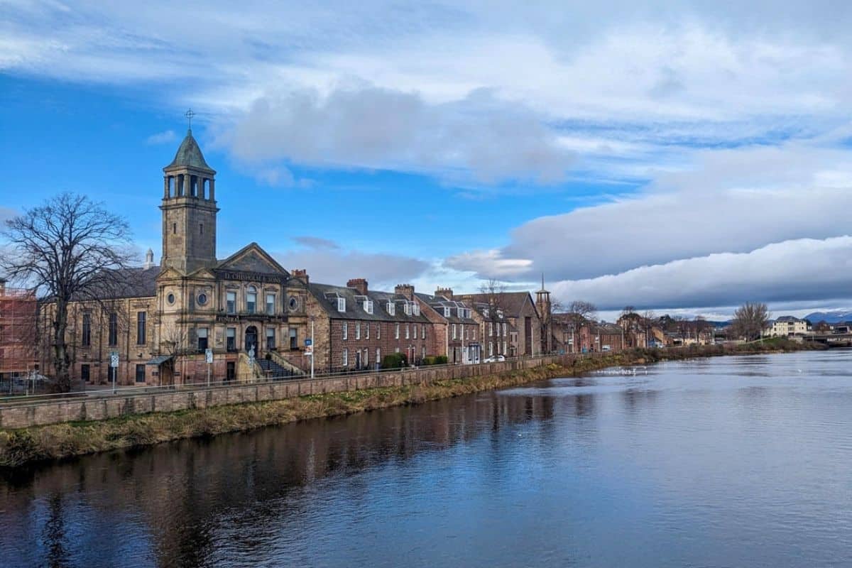 Where to Stay in Scotland Without a Car: Best Areas + Hotels 3 View of Inverness from a bridge over the River Ness in Inverness.