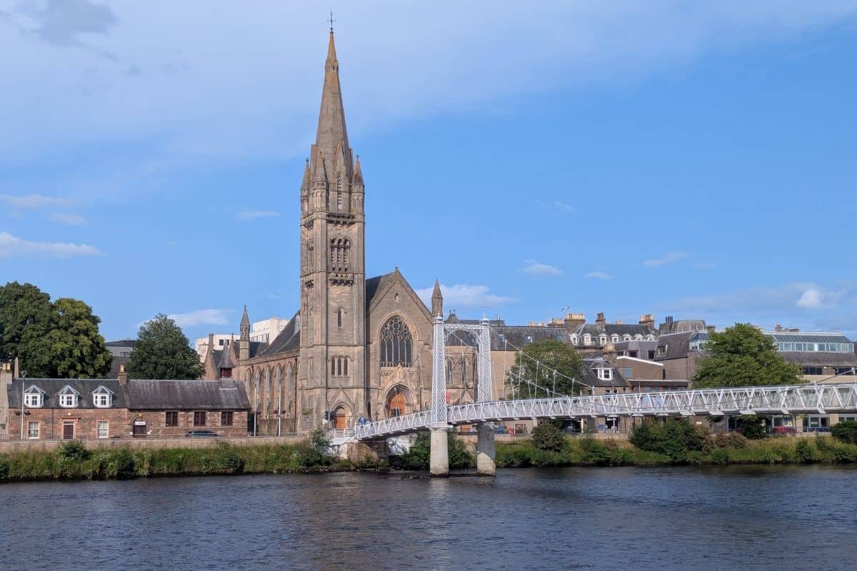 Where to Stay in Scotland Without a Car: Best Areas + Hotels 1 River Ness, bridge and church in Inverness for where to stay in Scotland without a car.